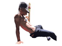 a man laying on the ground with a stick in his hand